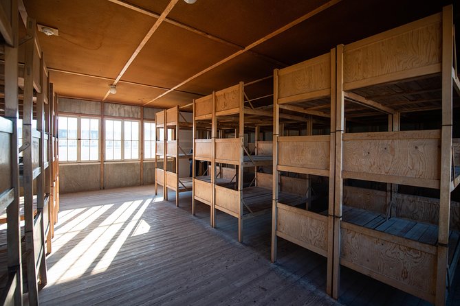 Dachau Concentration Camp Memorial Site Tour from Munich by Train - Walking through the gate and reconstructed barracks