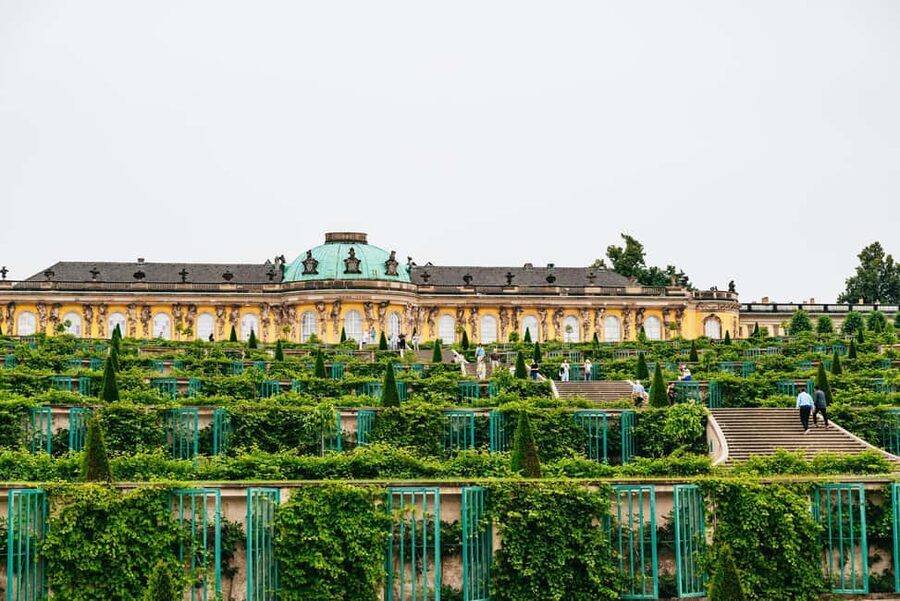 From Berlin: Potsdam and Sanssouci Palace Tour with Entry - The bus ride through Berlin and Potsdam