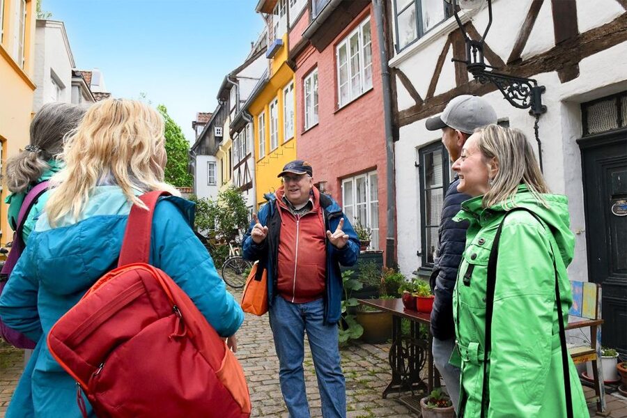 Lübeck: entertaining guided tour to old town highlights - Starting beneath Lübeck’s famous Holstentor