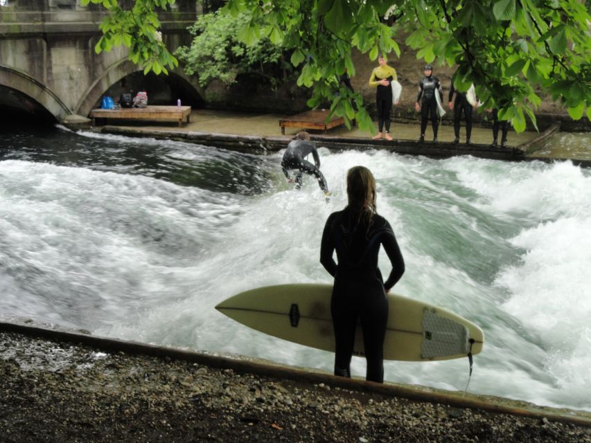 Munich Surf Experience Surfing In Munich Eisbach River Wave - Getting ready with the supplied cold-water equipment